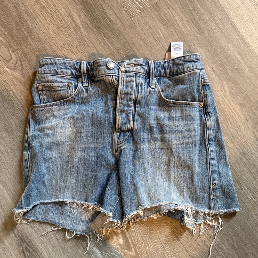 Good American Washed Blue Raw Hem Denim Cutoff Shorts